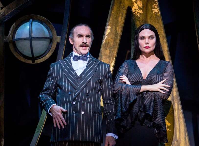 Gomez Addams played by Cameron Blakely and Morticia Addams played by Samantha Womack