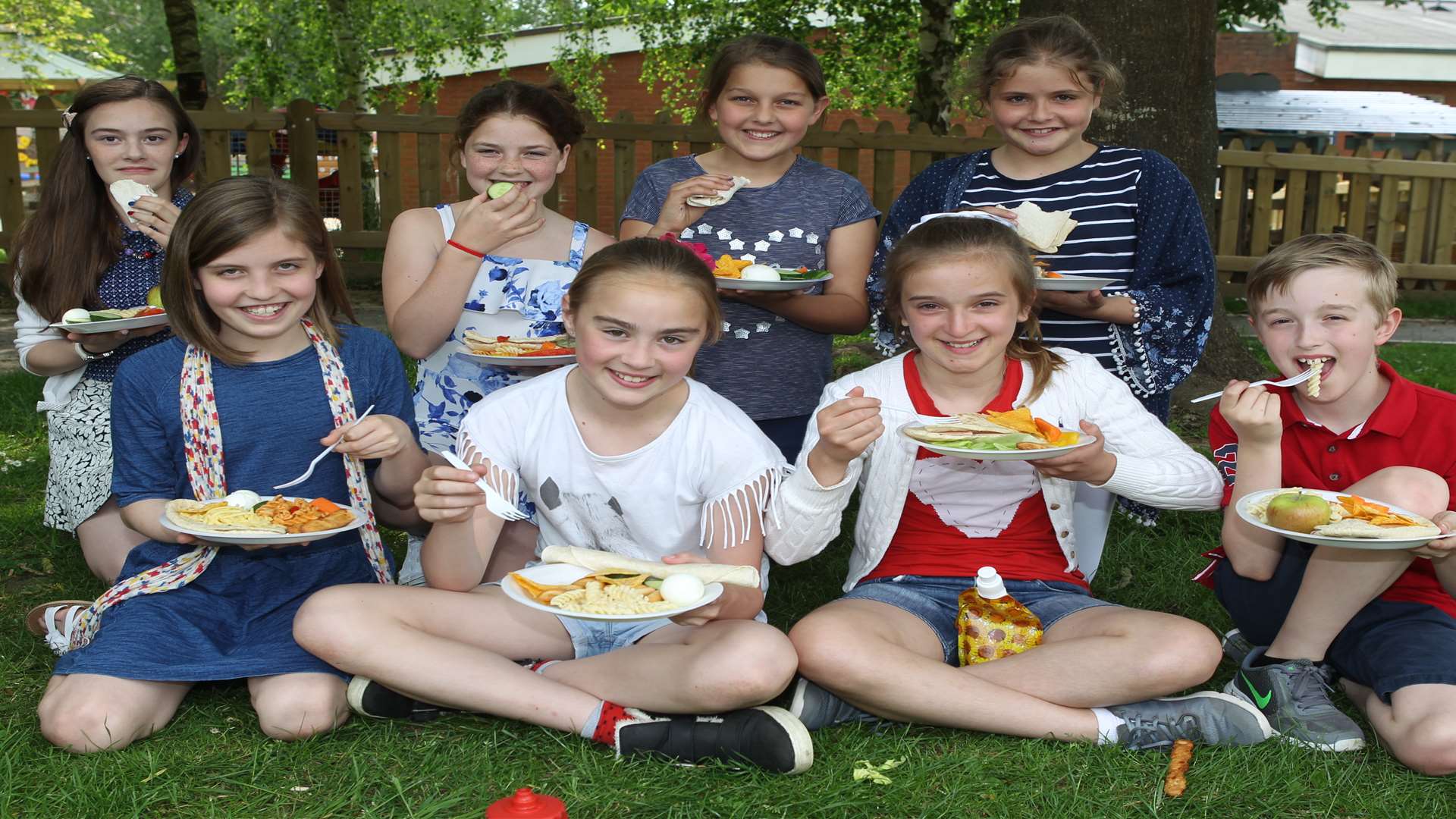 Year 6 pupils at Wateringbury Primary School enjoy the picnic. Picture: John Westhrop
