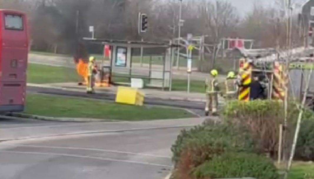 Firefighters at the bus stop on the Bridgefield estate in Ashford