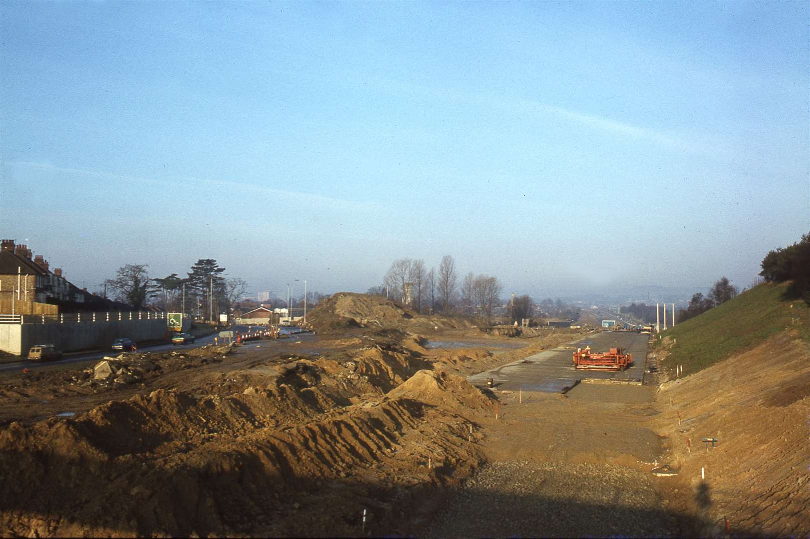 The M20, although incomplete is already carving its way through the Willesborough section of the site, pictured in 1980. Picture: Neville Marsh
