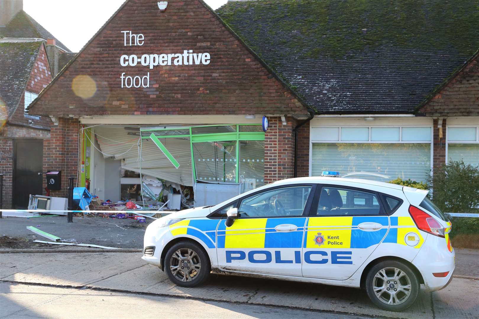 Officers are on scene after the shop was raided overnight. Picture: Andy Jones