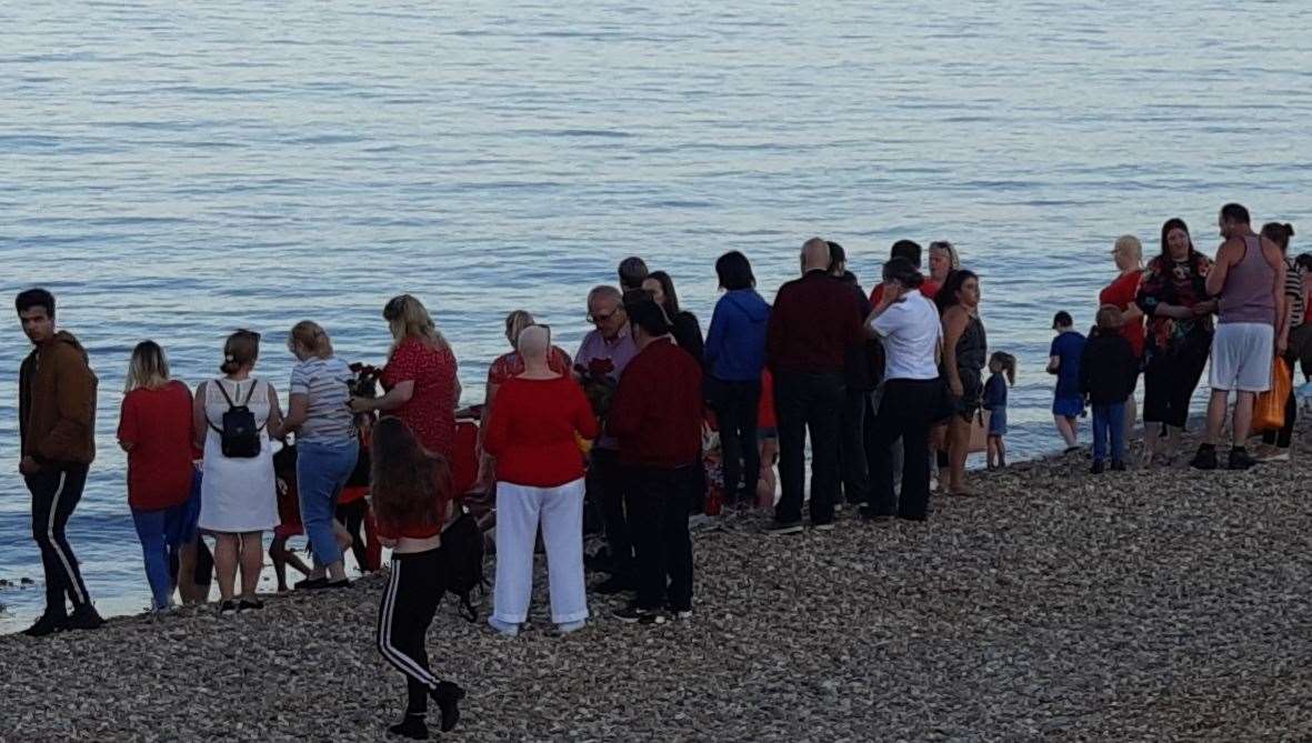 Petals thrown into the sea at the end of the vigil at Deal