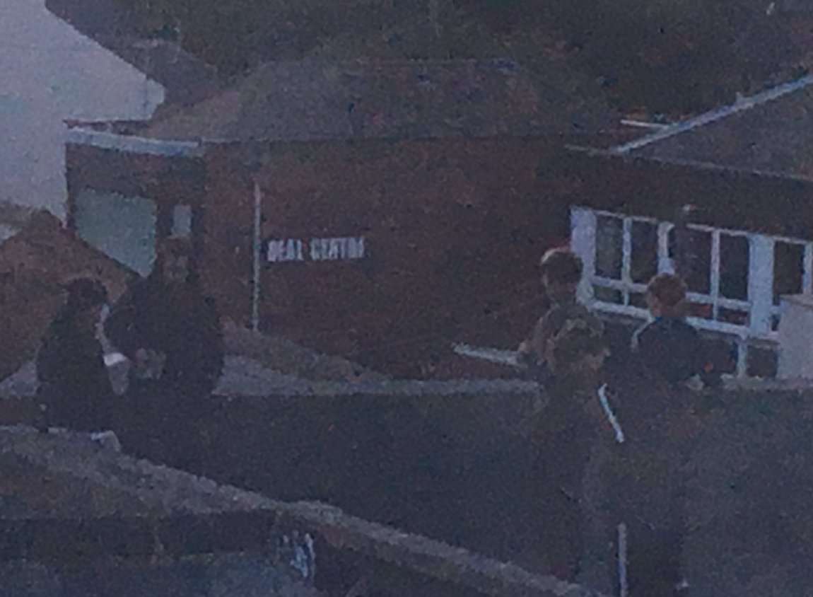 A photo sent to Kent Police on Twitter showing children on the roof of a property in Deal High Street. Picture: @Boredofthisstuf