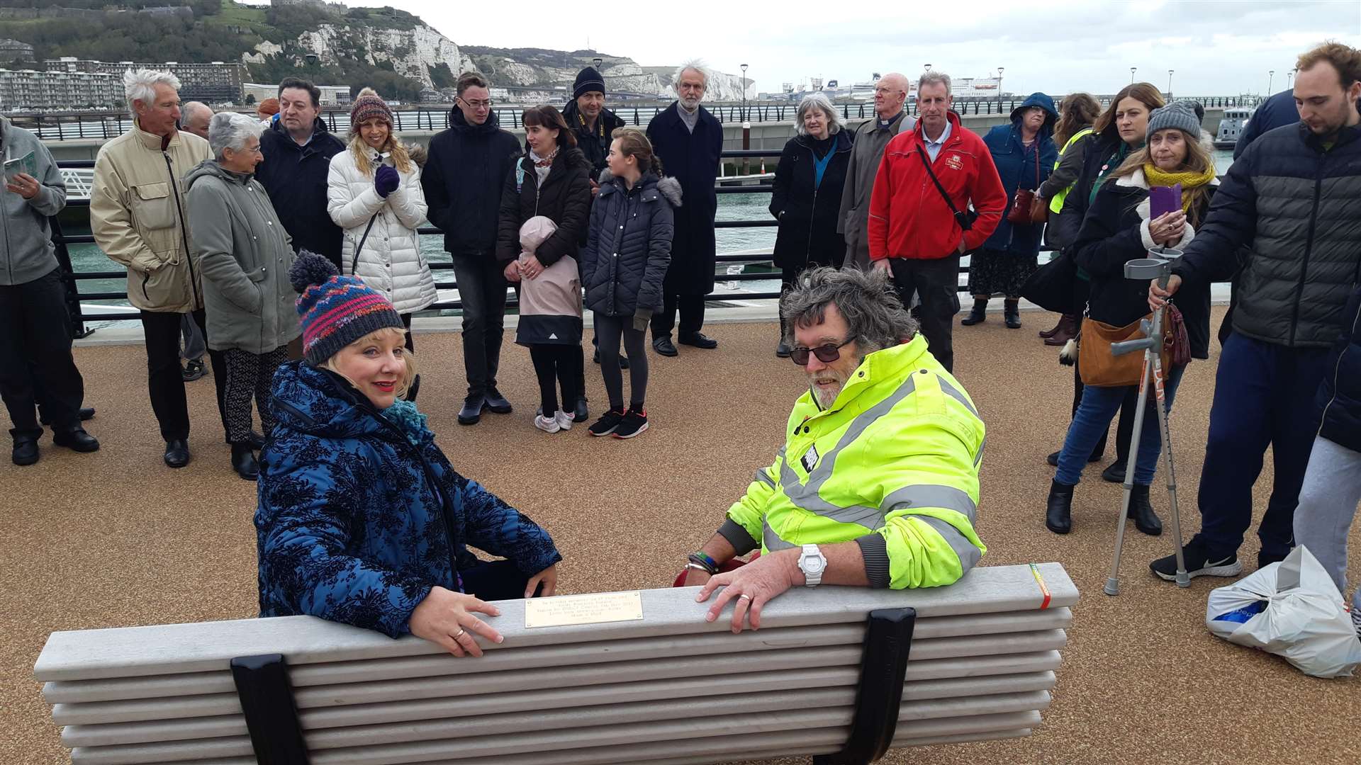 Martin and Linda Turner on the memorial bench with the gathering of well wishers. Picture: Sam Lennon