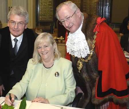 Ann Widdecombe signs the Roll of Honorary Freemen watched by the mayor, Richard Ash, and deputy chief executive Trevor Gasson. Picture: JOHN WARDLEY