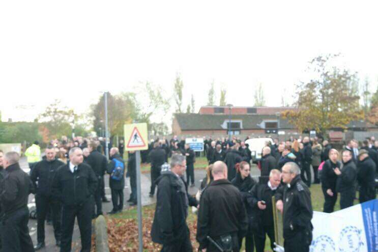 Workers outside the Sheppey prison cluster