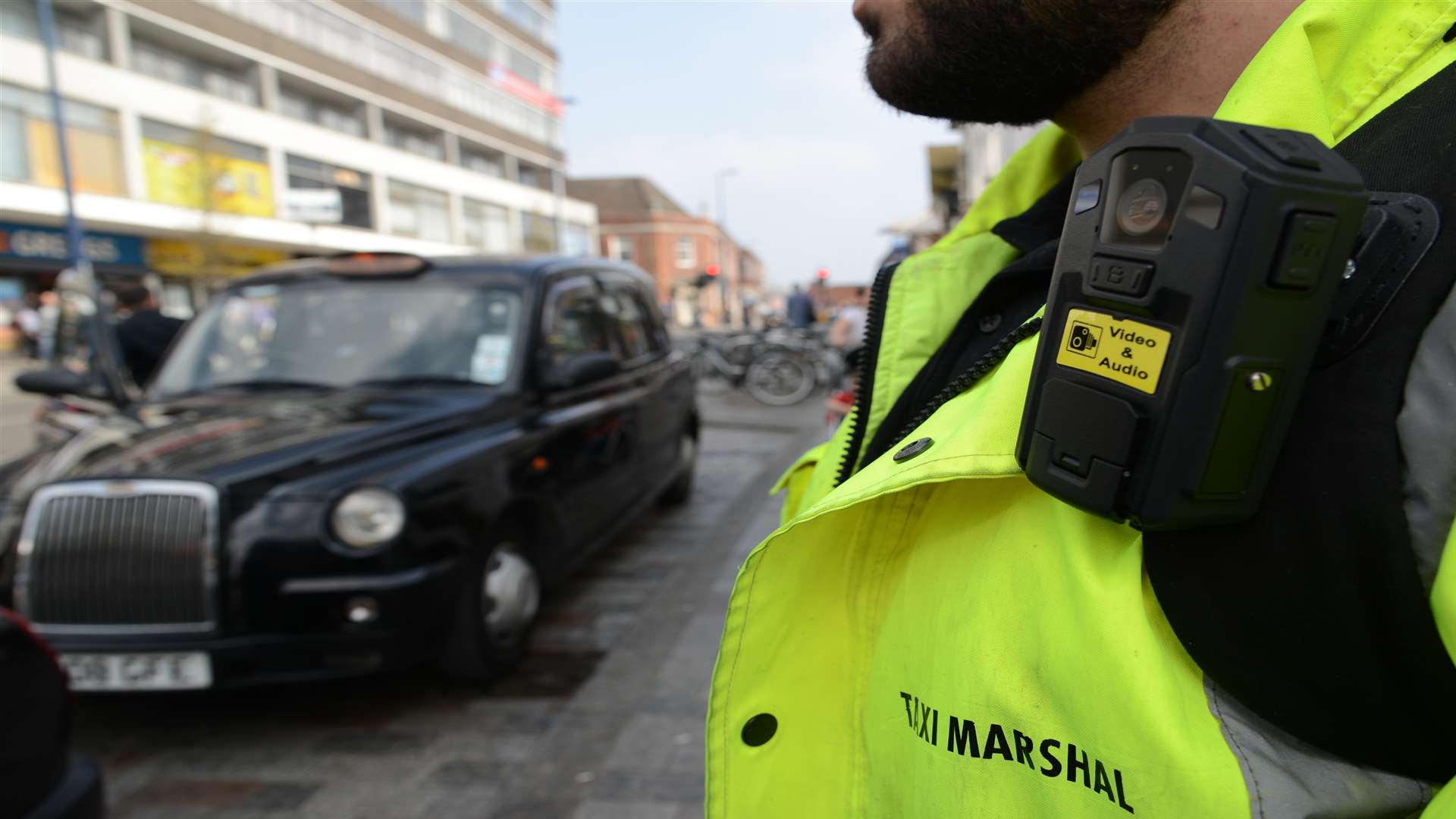 Taxi marshal with body camera in King Street, Maidstone