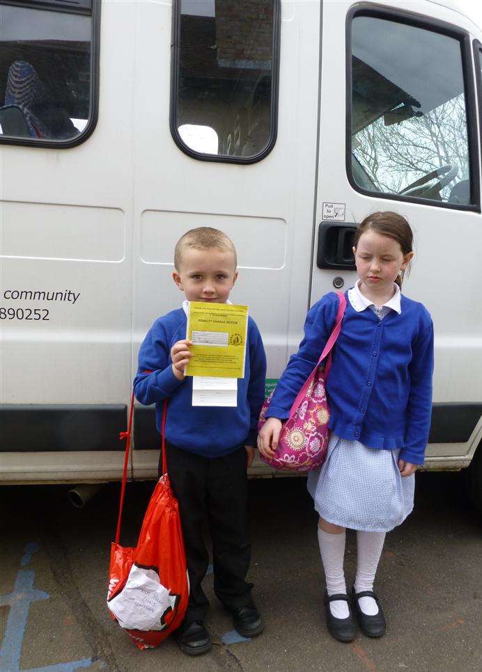 Eastling primary school pupils Cameron Hann and Nancy Anning with the parking ticket