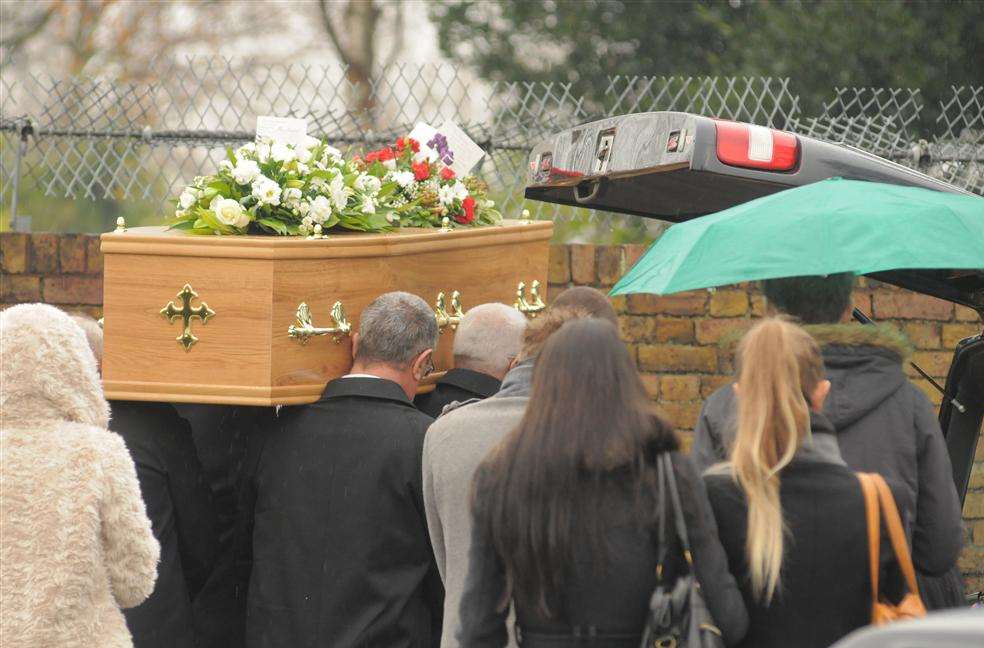 Mr Langley's coffin is carried into Holy Trinity Church