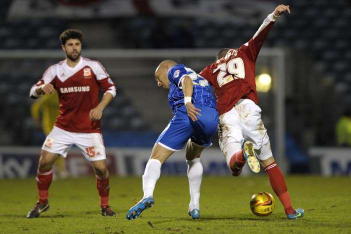 Craig Fagan battles against Swindon at Priestfield on Saturday. Picture: Barry Goodwin