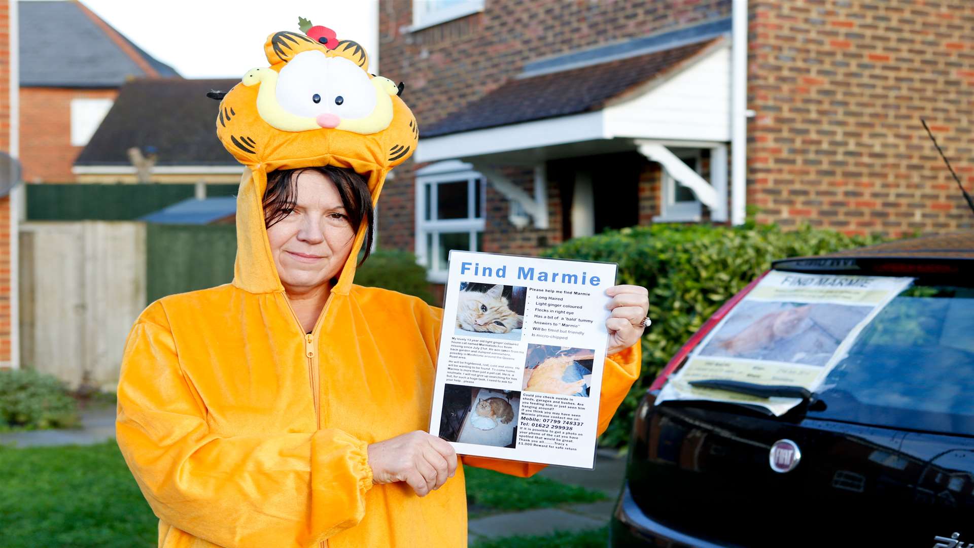 Tracy Brewster prepares to leave her home for a 50 mile walk from Kent to Essex dressed as Garfield to raise awareness of her campaign to find her missing cat