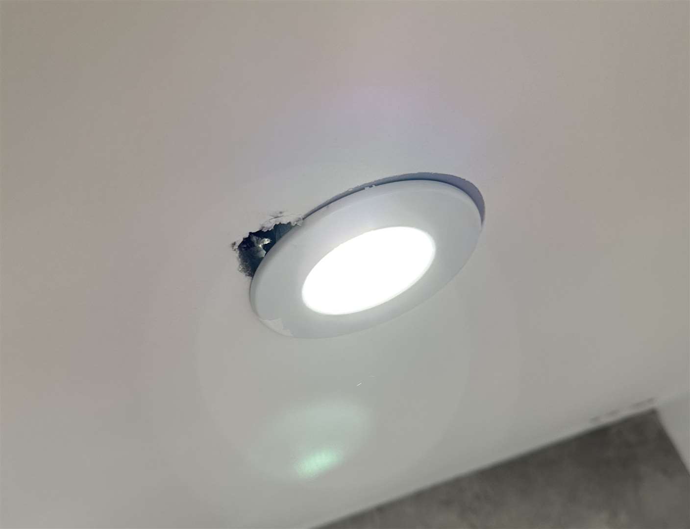 A hole next to a light-fitting in the new-build Herne Bay home. Photo: Alex Marcu