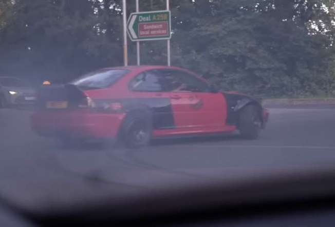 Warren Lees 'drifts' his BMW around a roundabout near Sandwich