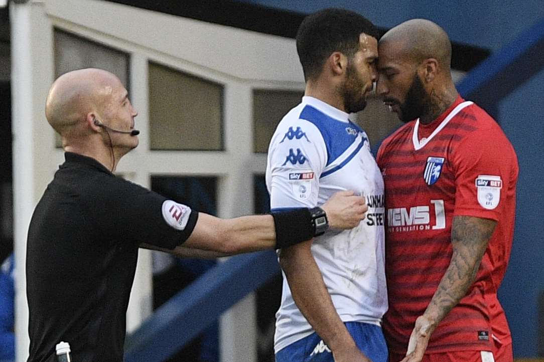 Referee Darren Drysdale separates Josh Parker and Jacob Mellis when the sides last met at Gigg Lane Picture: Ady Kerry