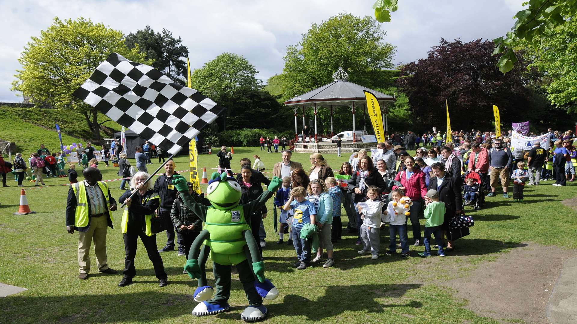 The record breaking walking bus sets off from Dane John Gardens, Canterbury led by mascot Buster and KM Charity Team trustees David Akporehe and Gill Delahunty.