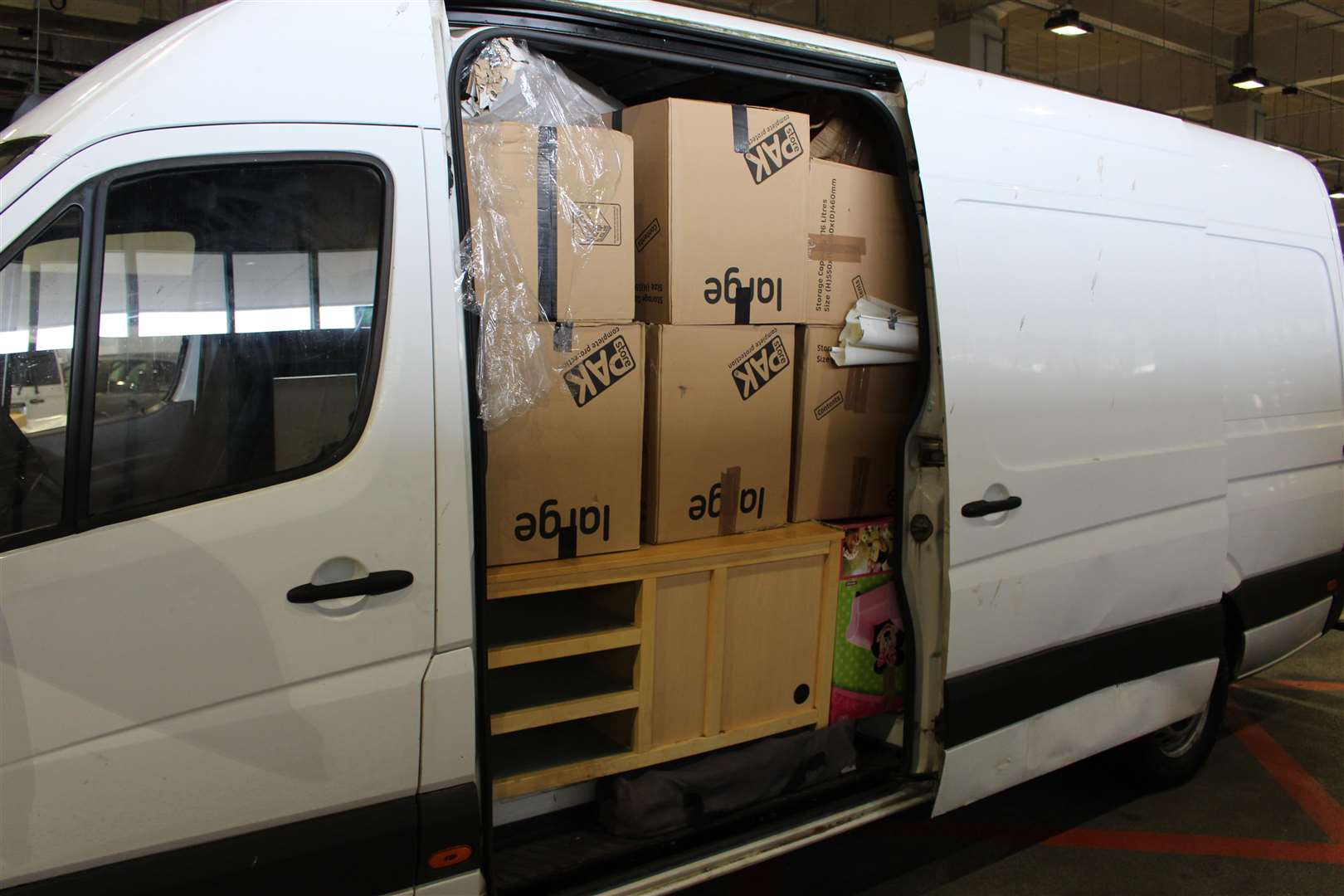 The migrants were hidden behind boxes in vans. Picture: Home Office