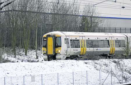 A Southeastern train in Wednesday morning's snow at Sevington, near Ashford. Picture: Gary Browne