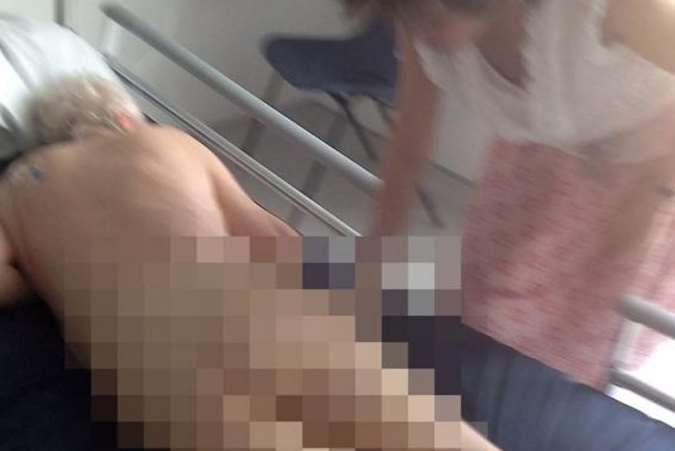 Frank Foster’s daughter released this picture of him naked in hospital to shame the carers she claims ignored his dying cries for help.