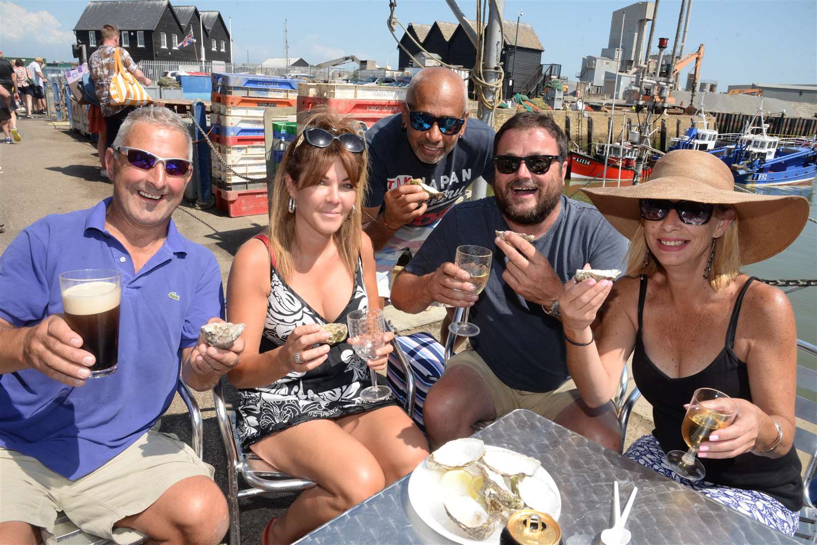 Steve Milward, Natalie Jemmett, Robin Partridge, George Duce and Rhiannon Turner sample oysters at the Whitstable Oyster Festival on Saturday. Picture: Chris Davey... (3192396)