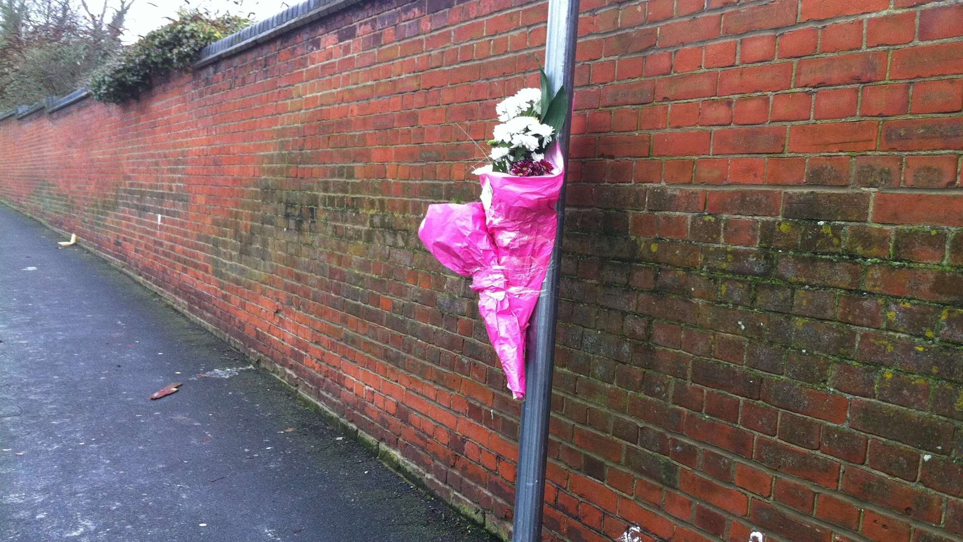Flowers at the spot in Windmill Road, Gillingham, where David Young was stabbed