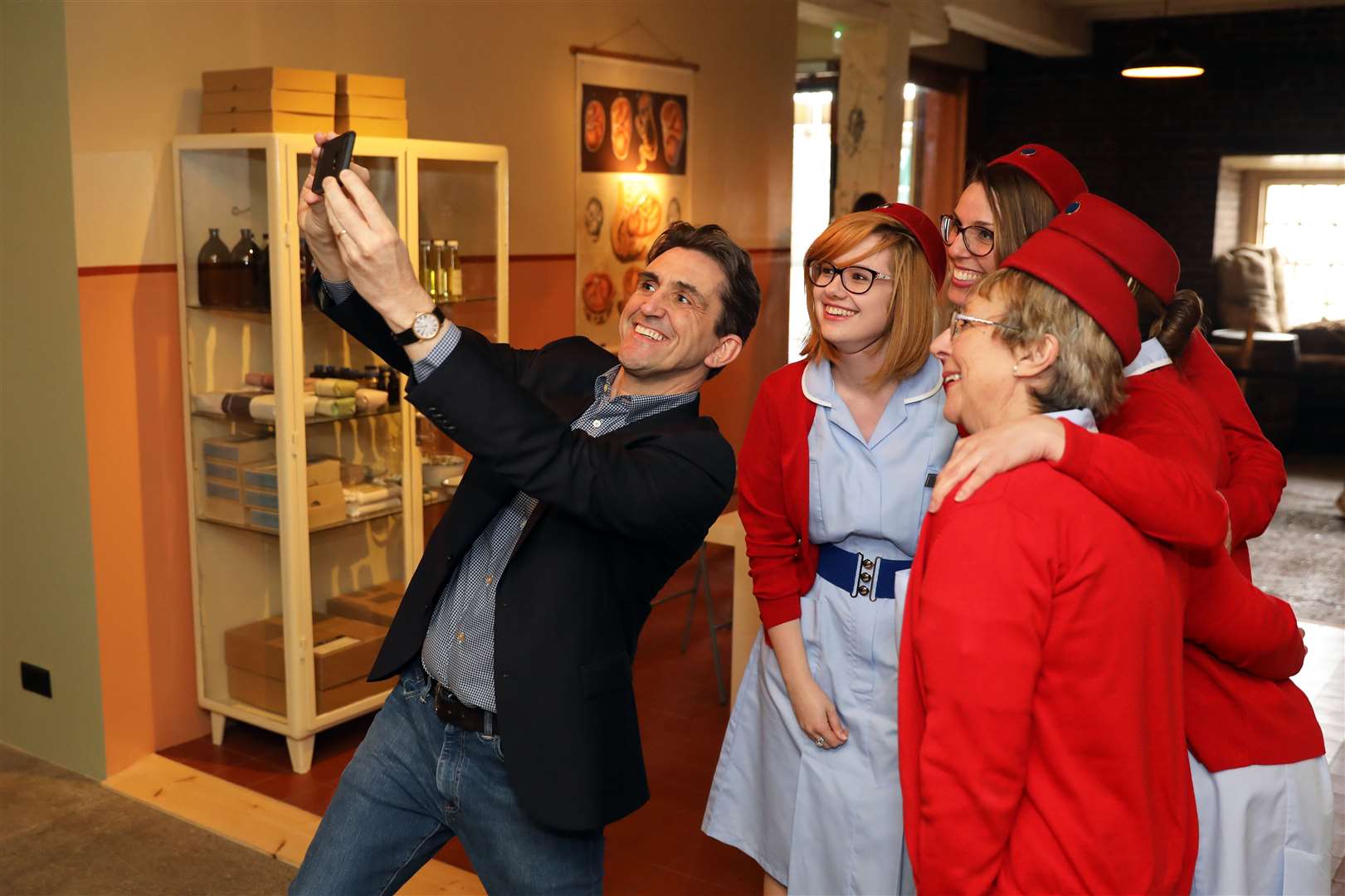 Stephen McGann (Dr Turner) with the midwife tour guides at the launch with Neal Street Productions Picture: Daniel Turner