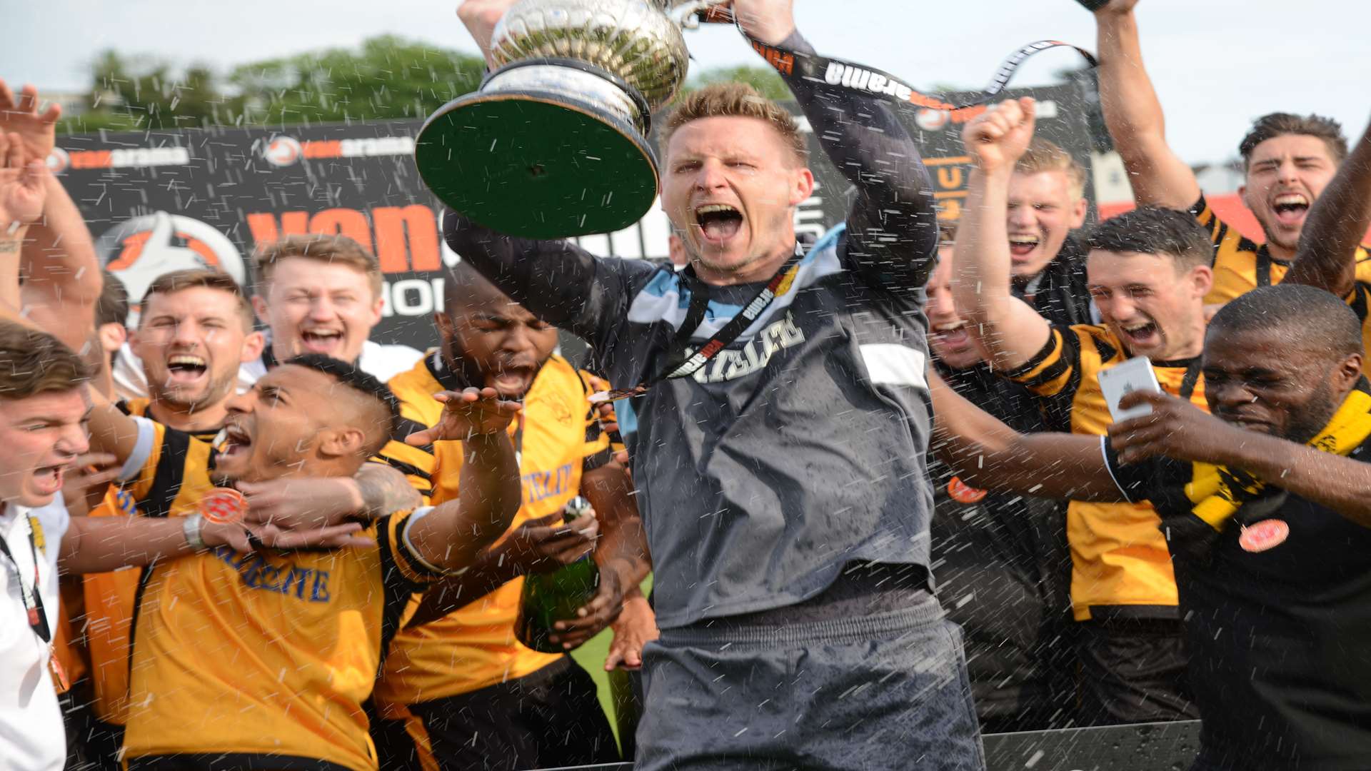 Maidstone captain Lee Worgan lifts the National South play-off trophy Picture: Gary Browne