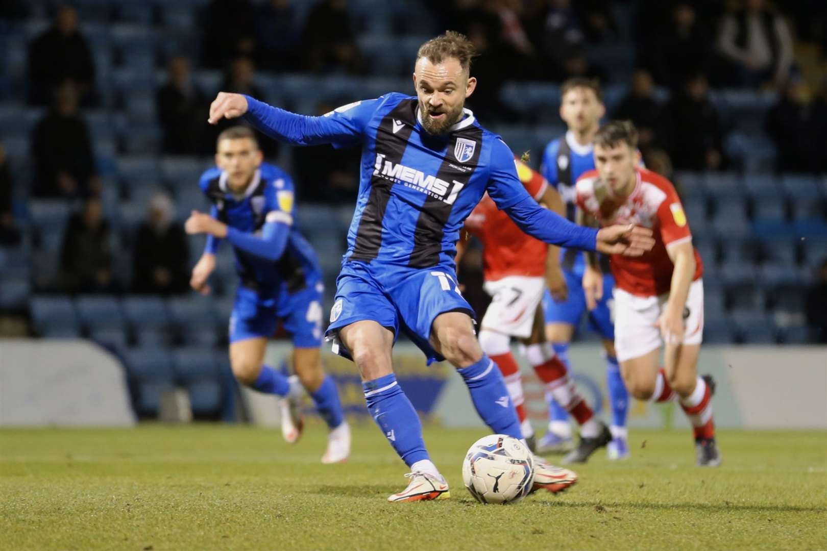 Danny Lloyd puts Gillingham ahead from the penalty spot Picture: KPI