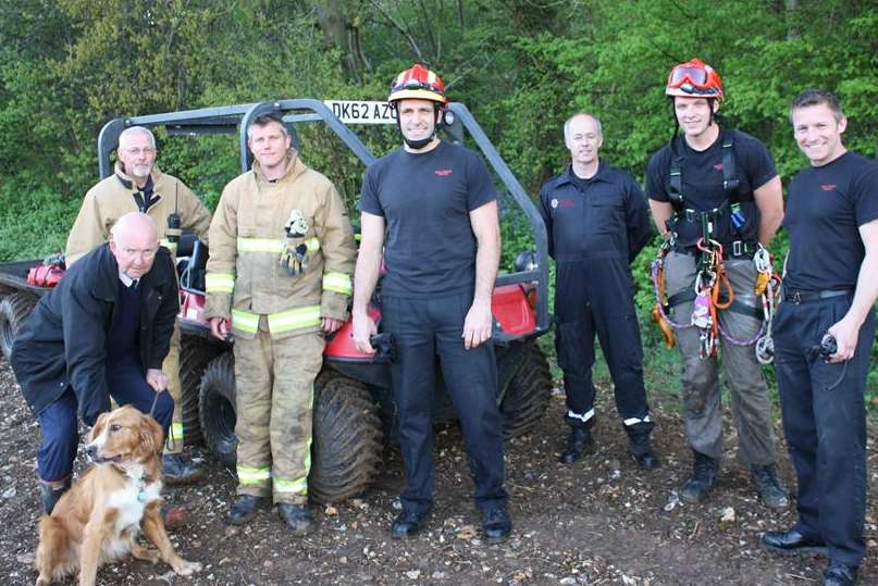 Fire and rescue crew members with rescued Brody