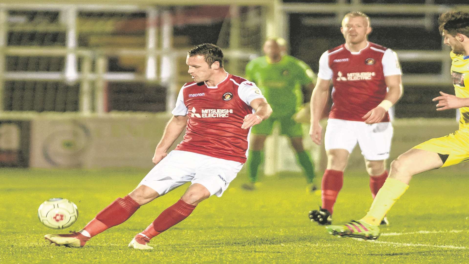 Andy Drury plays the ball forward against Woking Picture: Andy Payton