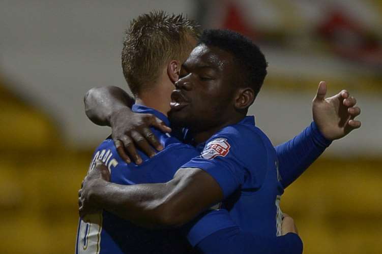 Luke Norris is congratulated by Adedeji Oshilaja after his second-half equaliser Picture: Barry Goodwin