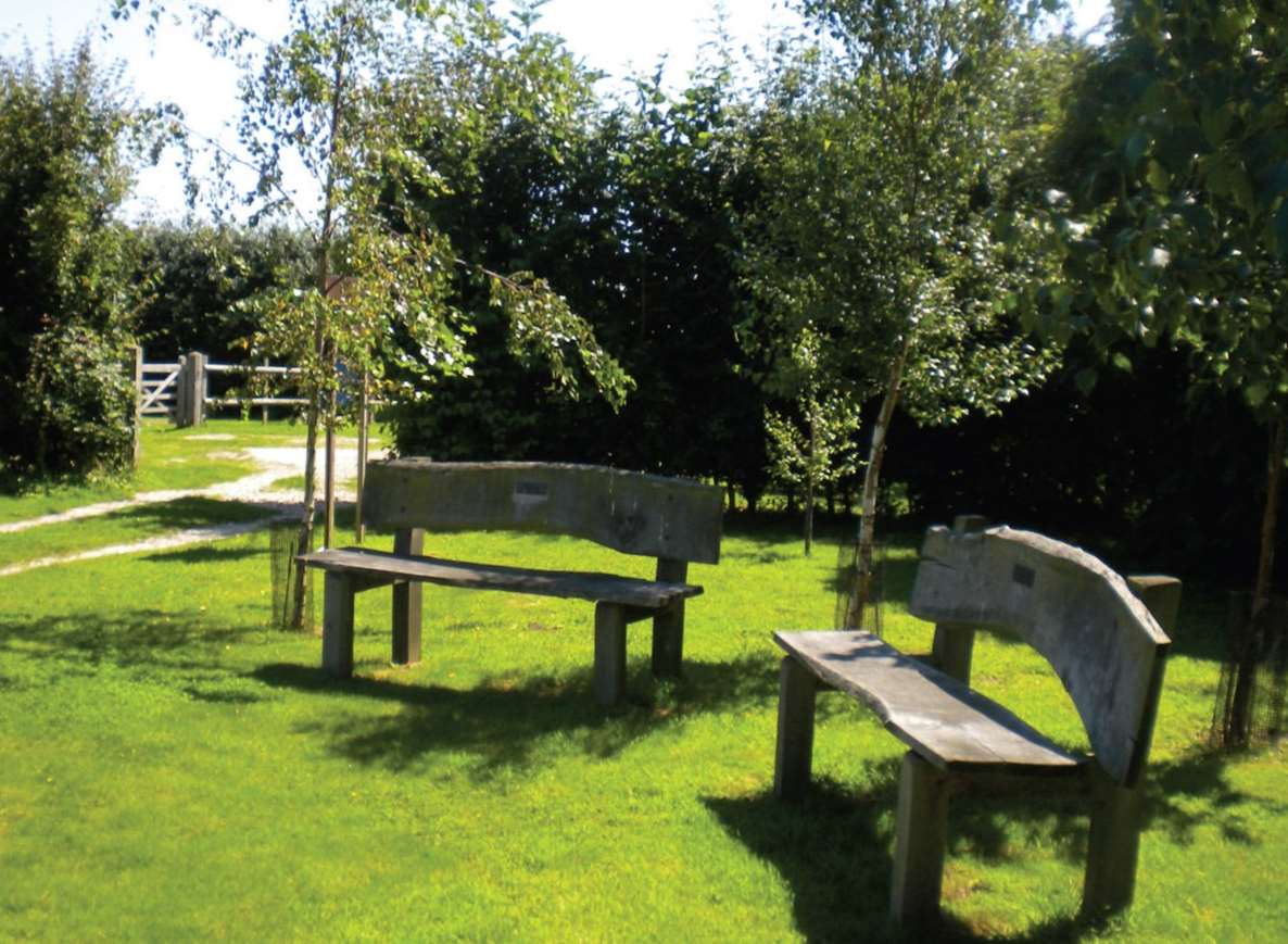 A seating area at Deerton Natural Burial Ground near Teynham