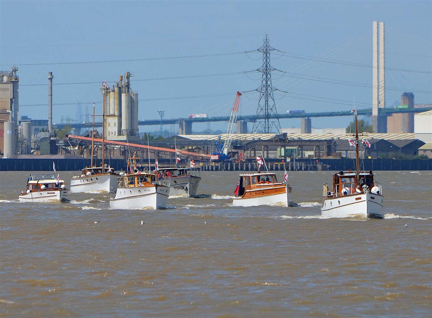 Dunkirk Little Ships sail along the River Thames near the bridge. Picture: Jason Arthur