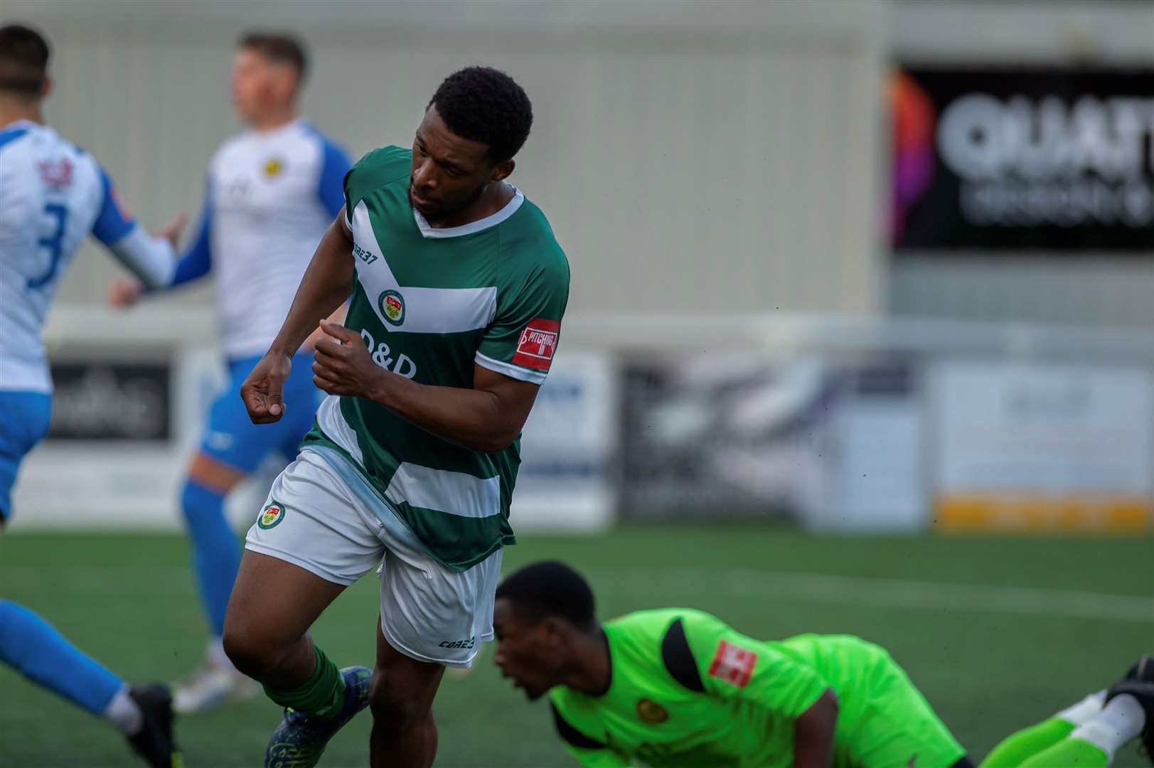 Vance Bola wheels away after scoring Ashford's second against Merstham. Picture: Ian Scammell