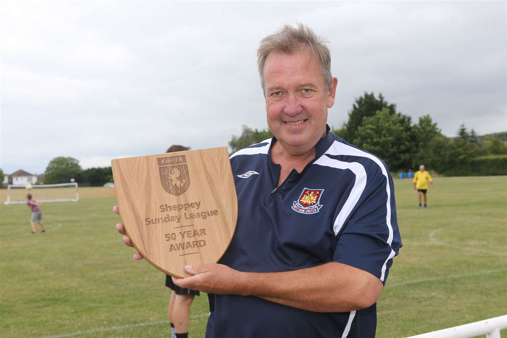Mark Rogers of the Sheppey Sunday League with the league's 50-year award from the Kent FA in June, 2017