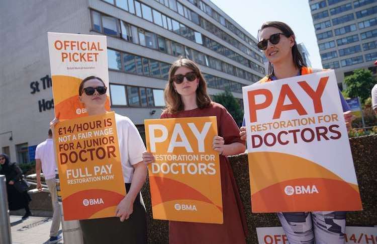 Striking junior doctors from British Medical Association (BMA) on the picket line outside St Thomas’ Hospital in London in June (PA)