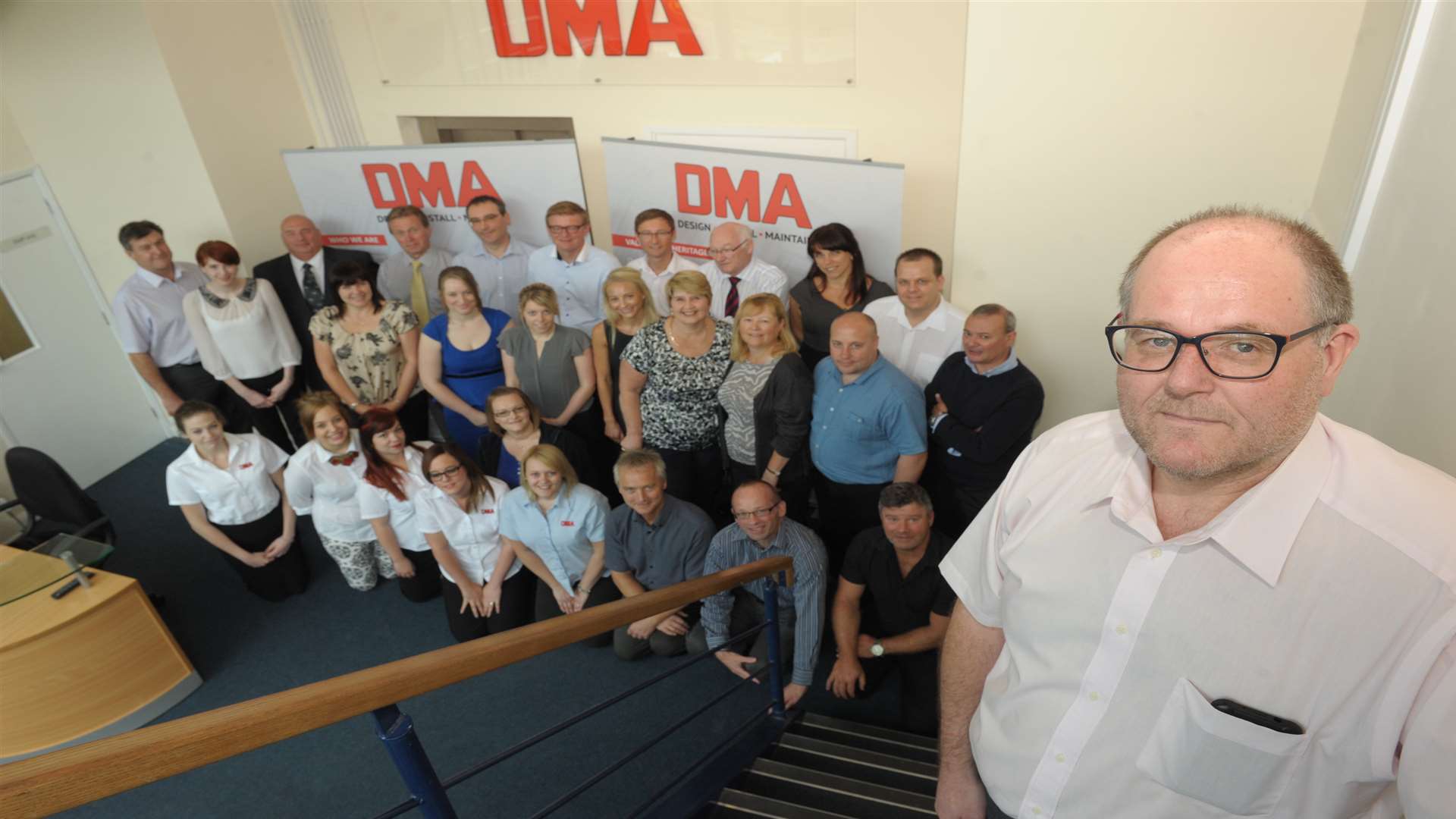 DMA Group managing director Pat Jackson with staff