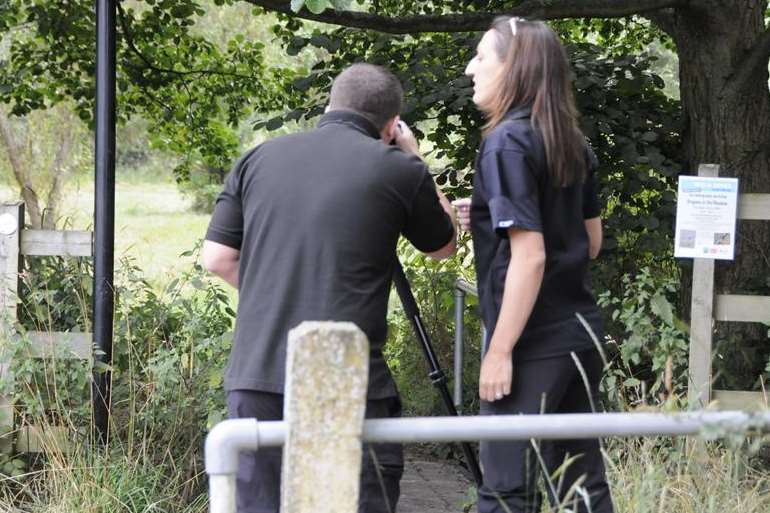 Police at the scene of a sex attack near Singleton Lake in August