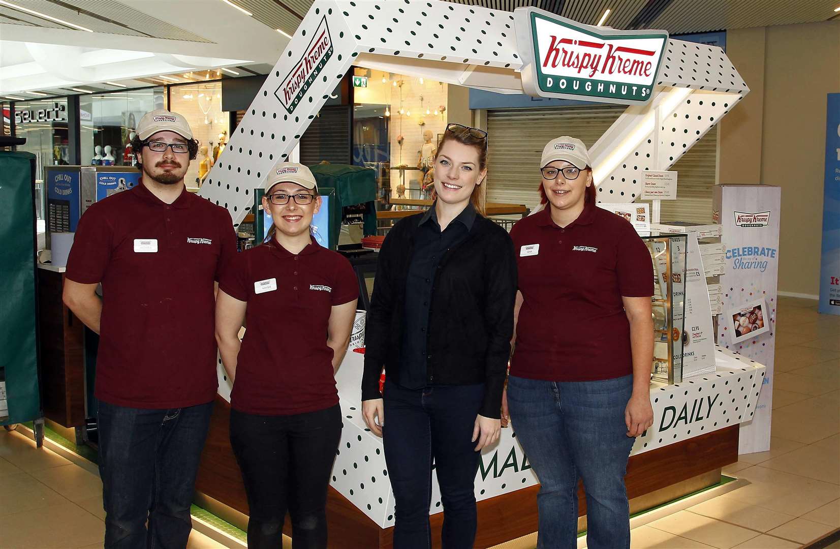 Krispy Kreme opens in the Mall MaidstoneStaff members Andrew Boyce, Kaysie Grover, Emily Daws and Gina Reed.Picture: Sean Aidan (2168981)