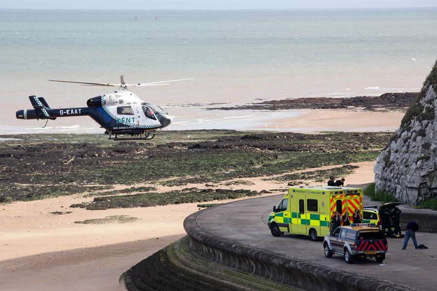 The air ambulance lands at the spot where Joshua Brown fell in Louisa Bay. Picture: James Rene Weatherley