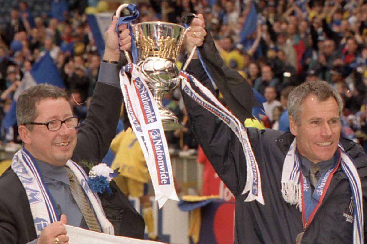 Gills chairman Paul Scally and then-boss Peter Taylor celebrate promotion at Wembley in 2000