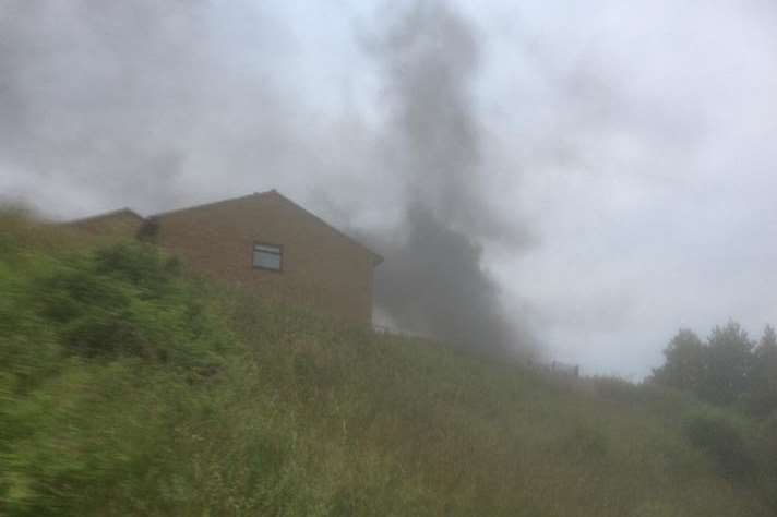 Thick smoke billowing from the burning car in Heron Way. Picture: S and J News, Rochester
