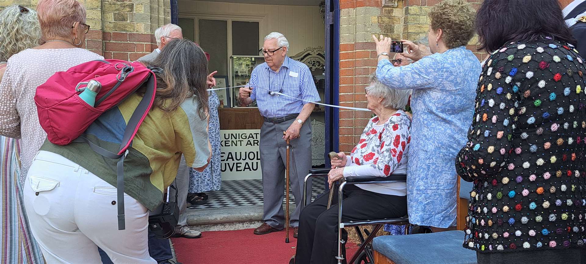 Ron Haggarty cuts the tape to open The Heart of Headcorn