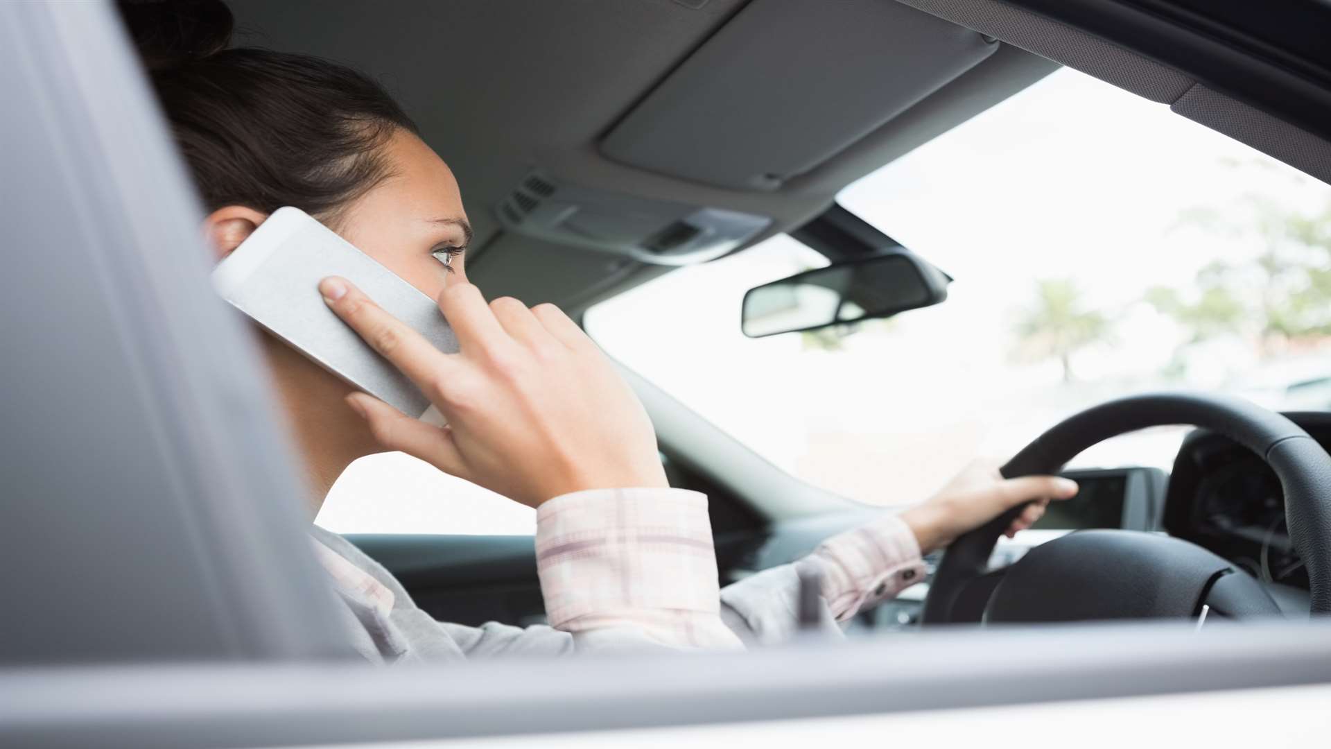 Police are fining fewer people for using phones while driving