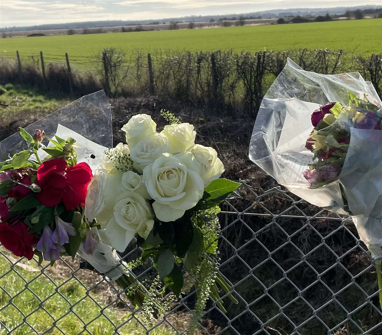 Flowers were left in tribute near the scene