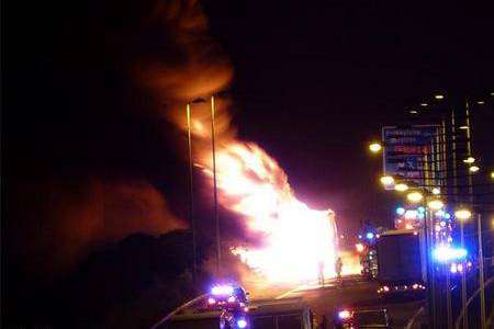 Flames lick the skyline after a lorry caught fire on the M20