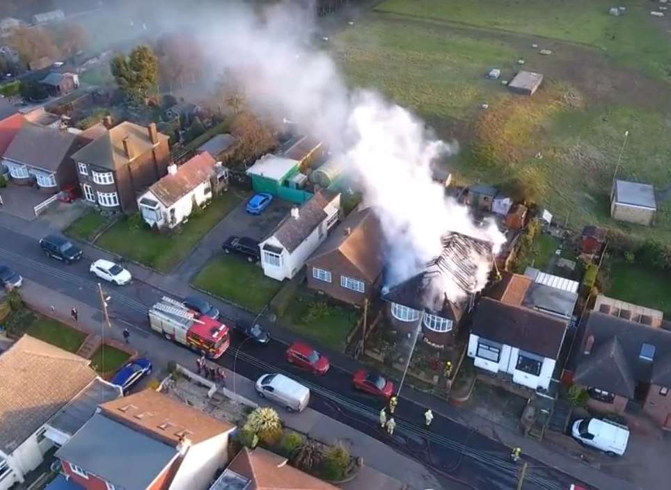 Smoke billows into the air as crews tackle the flames