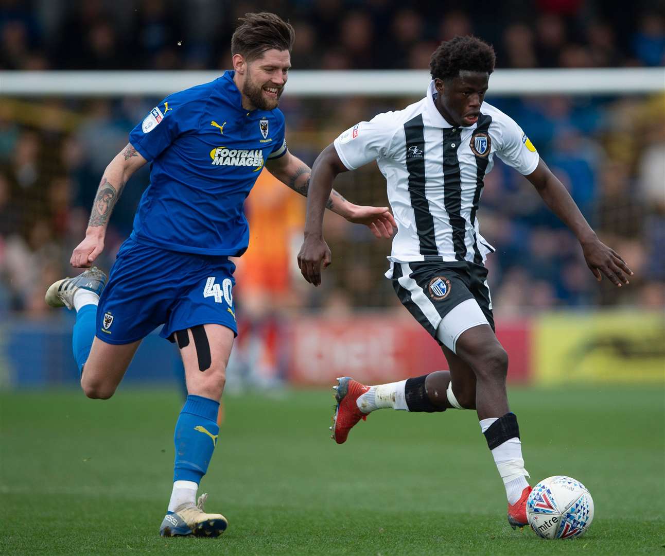 Gills midfielder Leo Da Silva Lopes gets away from Anthony Wordsworth Picture: Ady Kerry