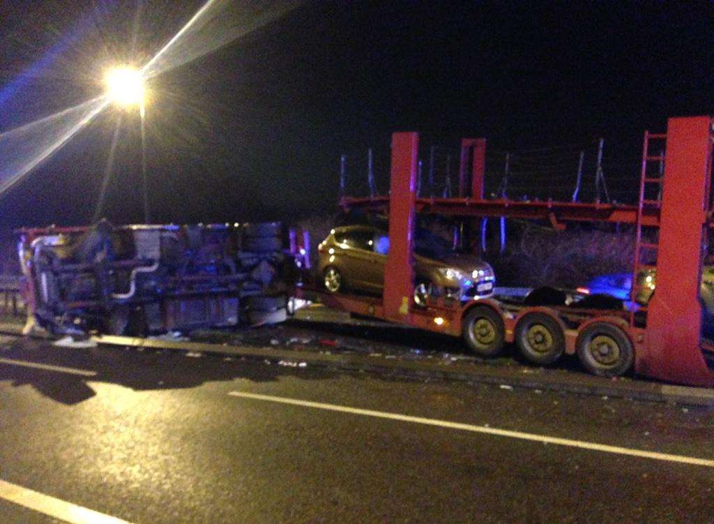 The transporter overturned onto the central crash barrier, seriously damaging it. Picture: Kent Police