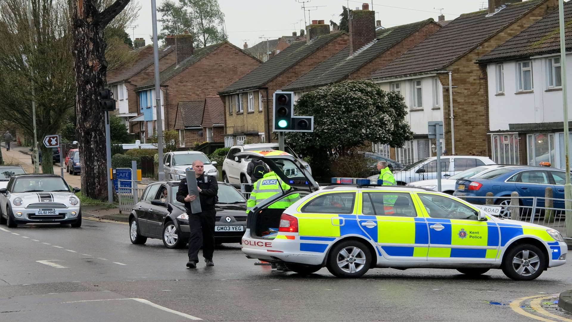 Police at the scene in Hythe Road. Picture: Andy Clark