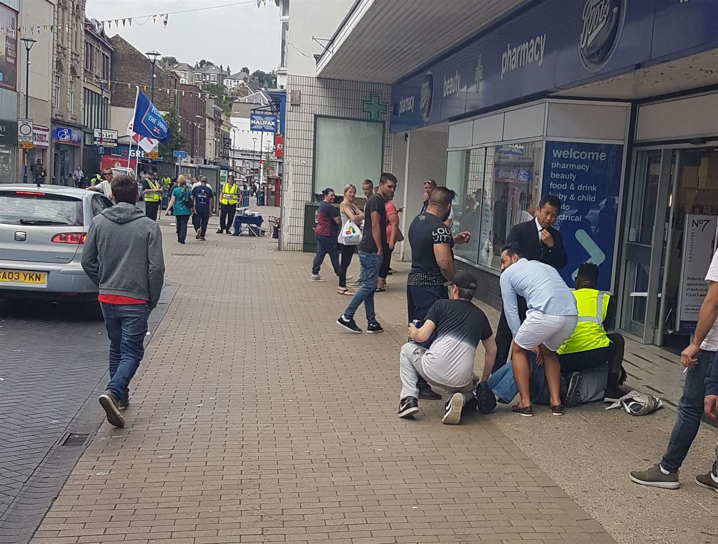 A man is restrained on the ground in Dover High Street